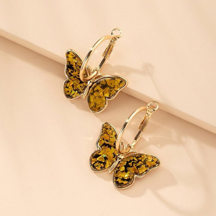 Boucles d'oreilles uniques peintes à la main en forme de papillon avec émail et cristal – une touche élégante pour toutes vos tenues