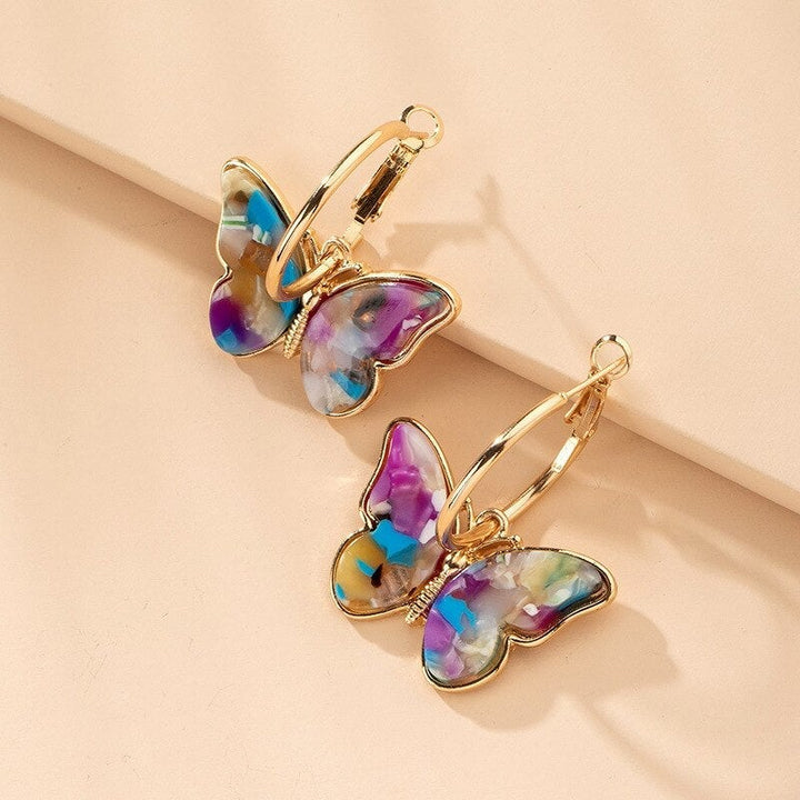 Boucles d'oreilles uniques peintes à la main en forme de papillon avec émail et cristal – une touche élégante pour toutes vos tenues