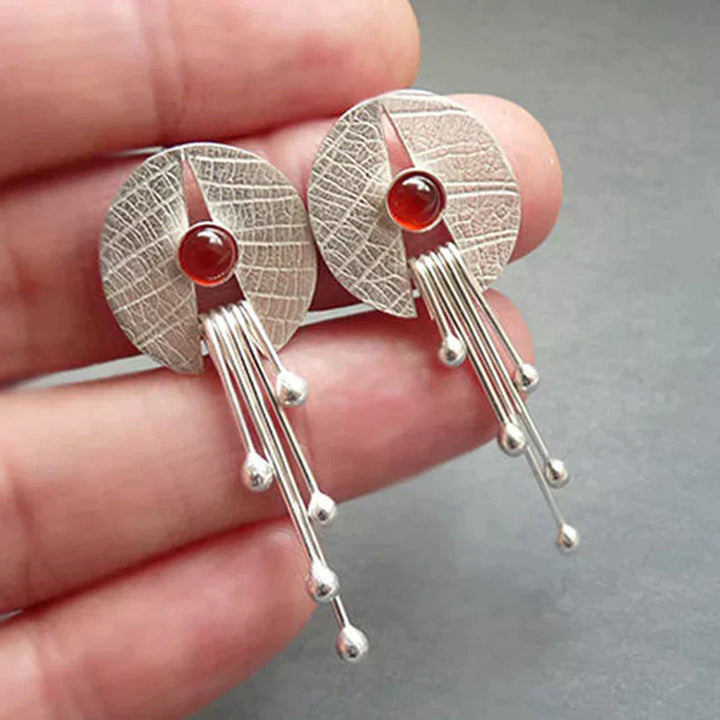 Boucles d'oreilles élégantes et exquises en pierre rouge